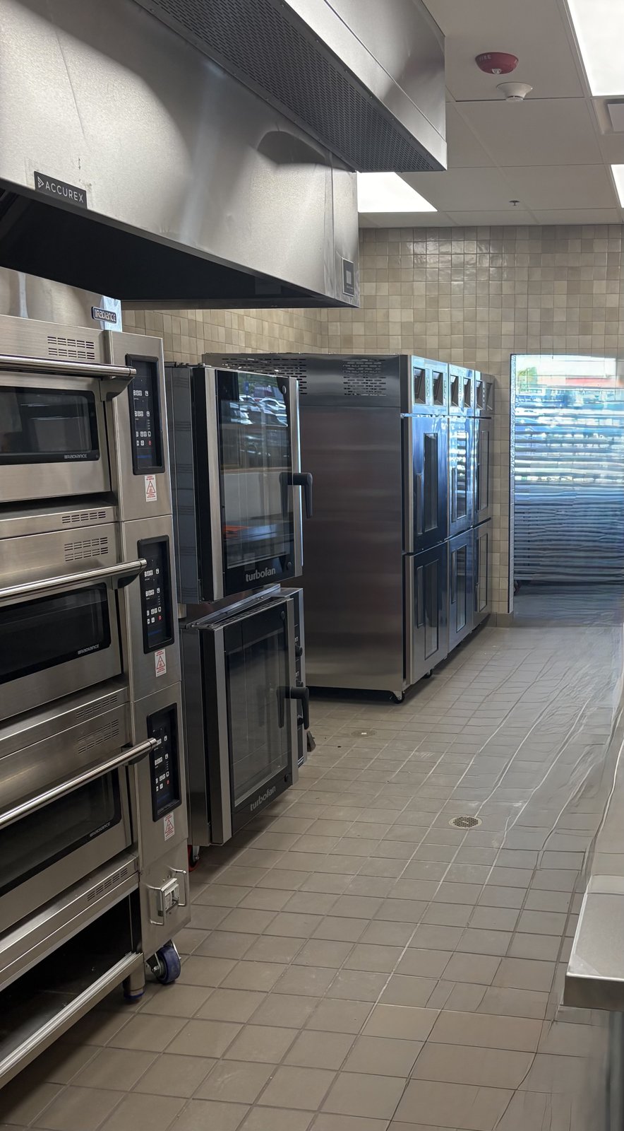 Full production bakery back of house with deck ovens and proofers