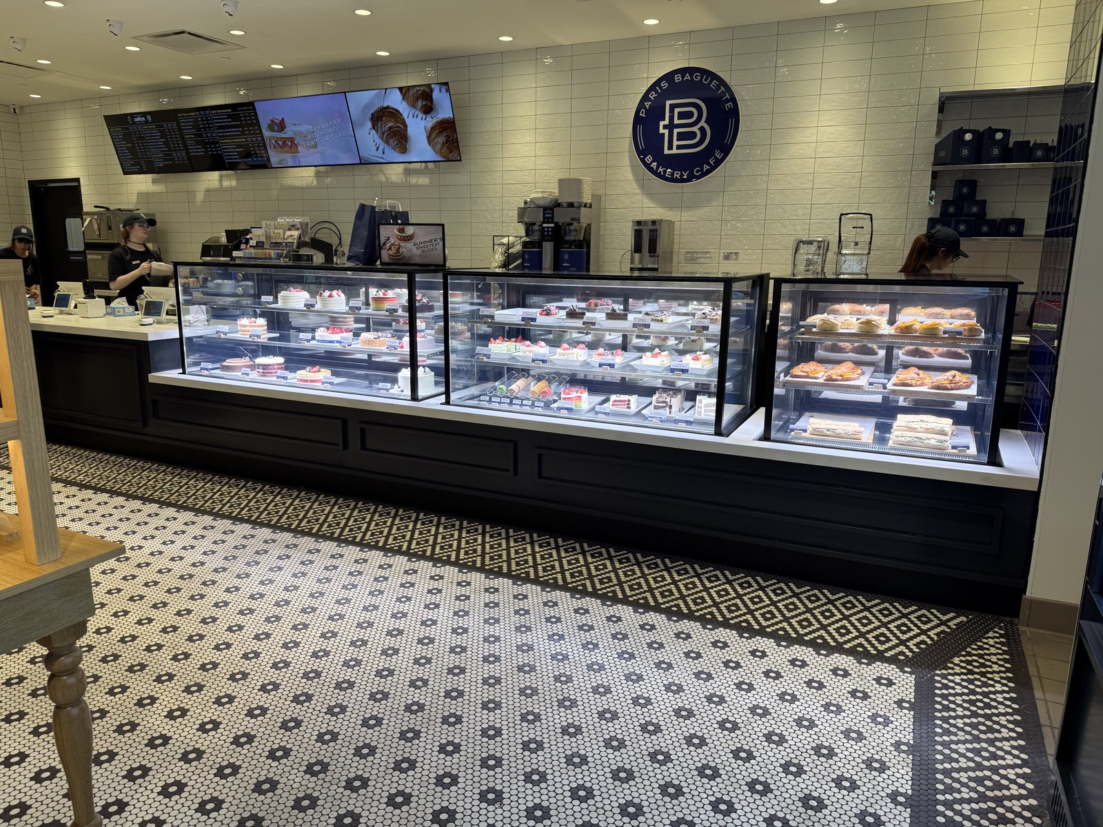Finished Paris Baguette café in operation with stocked bakery display cases